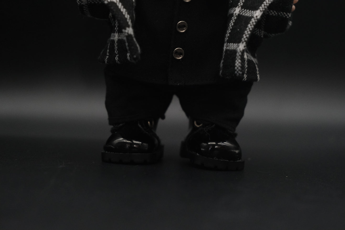 Close-up of Labubu wearing black pants from the streetwear outfit set.