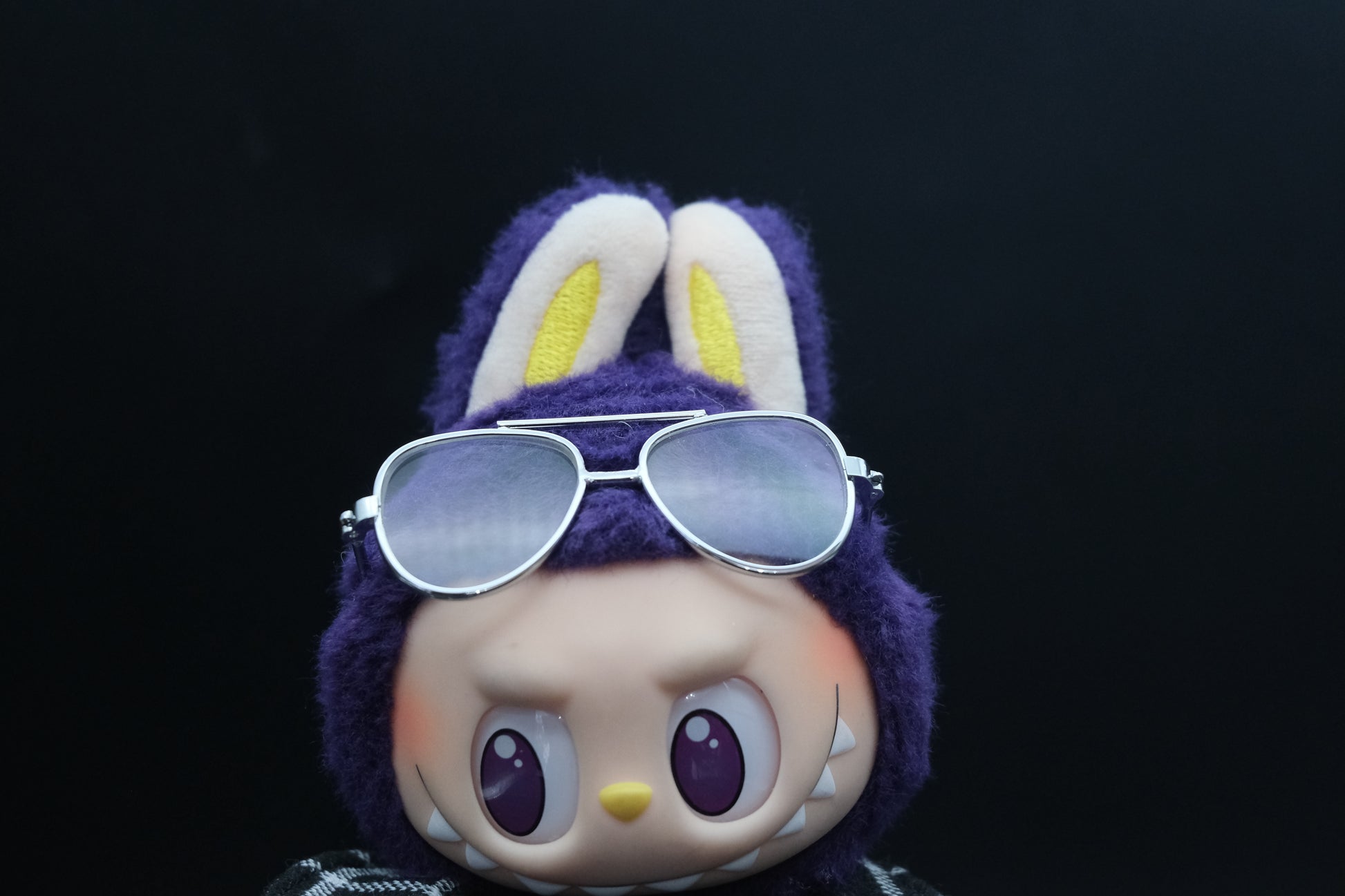 Close-up of Labubu wearing stylish sunglasses from the streetwear outfit set.