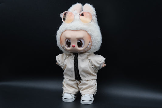 A Labubu figure wearing a white zippered jacket, white pants and and white sneakers.