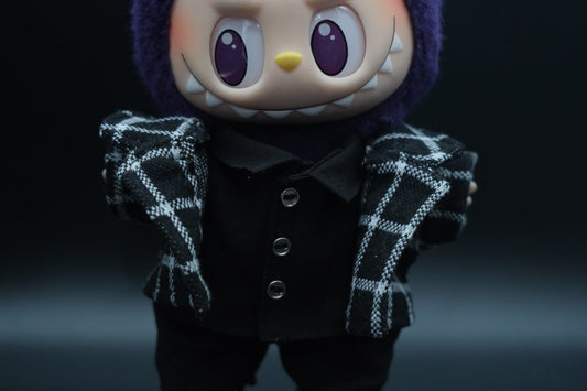 Close-up of a labubu wearing stylish plaid jacket from the streetwear outfit set.