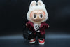 A Labubu figure wearing a 5-piece tech-wear outfit with a studded nylon jacket , jeans, bag sneakers and white t-shirt