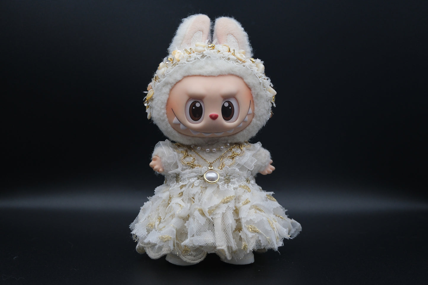 Labubu figure wearing a 3-piece white frill dress, necklace, and shoes, representing the Coquette or Angel Core aesthetic