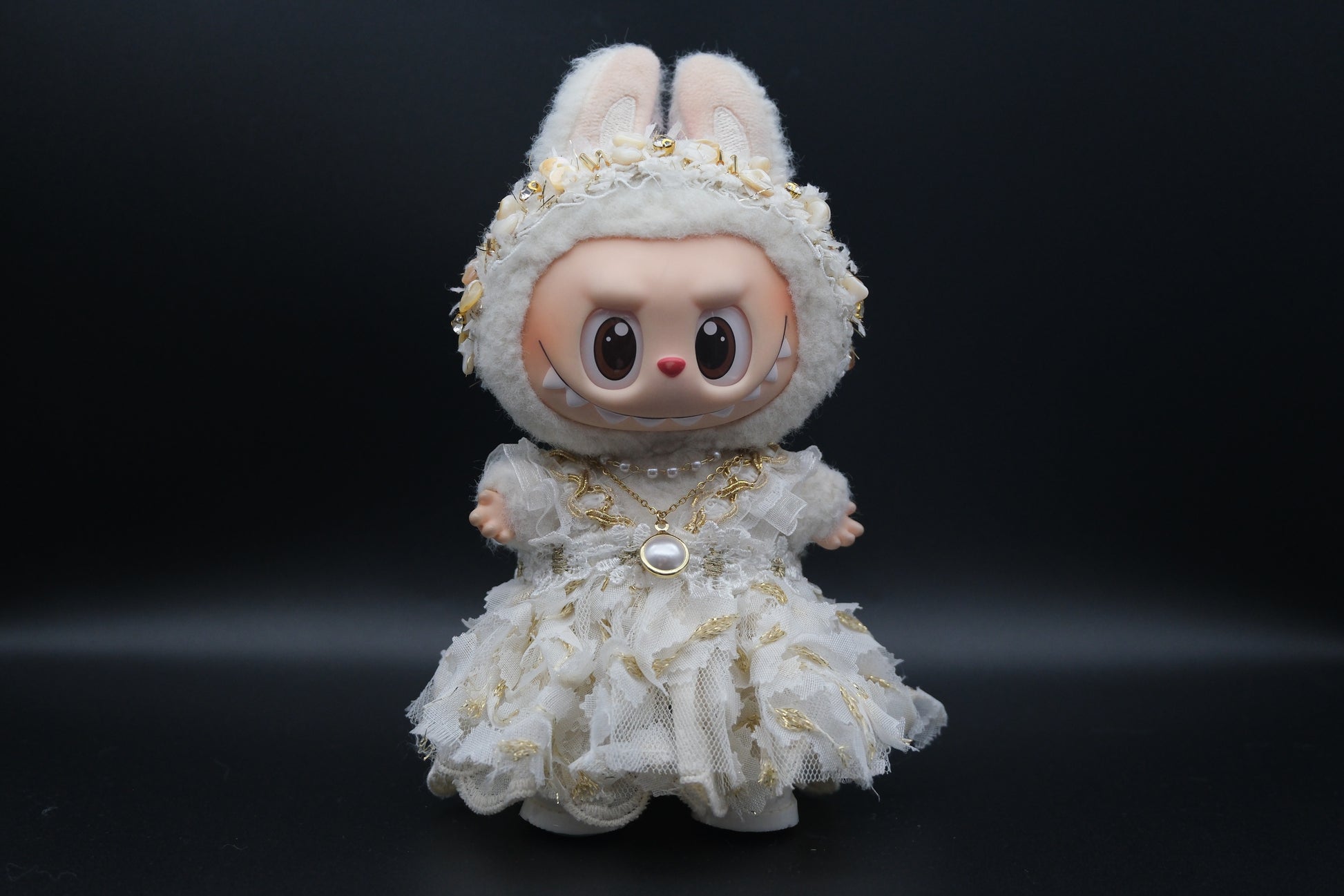 Labubu figure wearing a 3-piece white frill dress, necklace, and shoes, representing the Coquette or Angel Core aesthetic