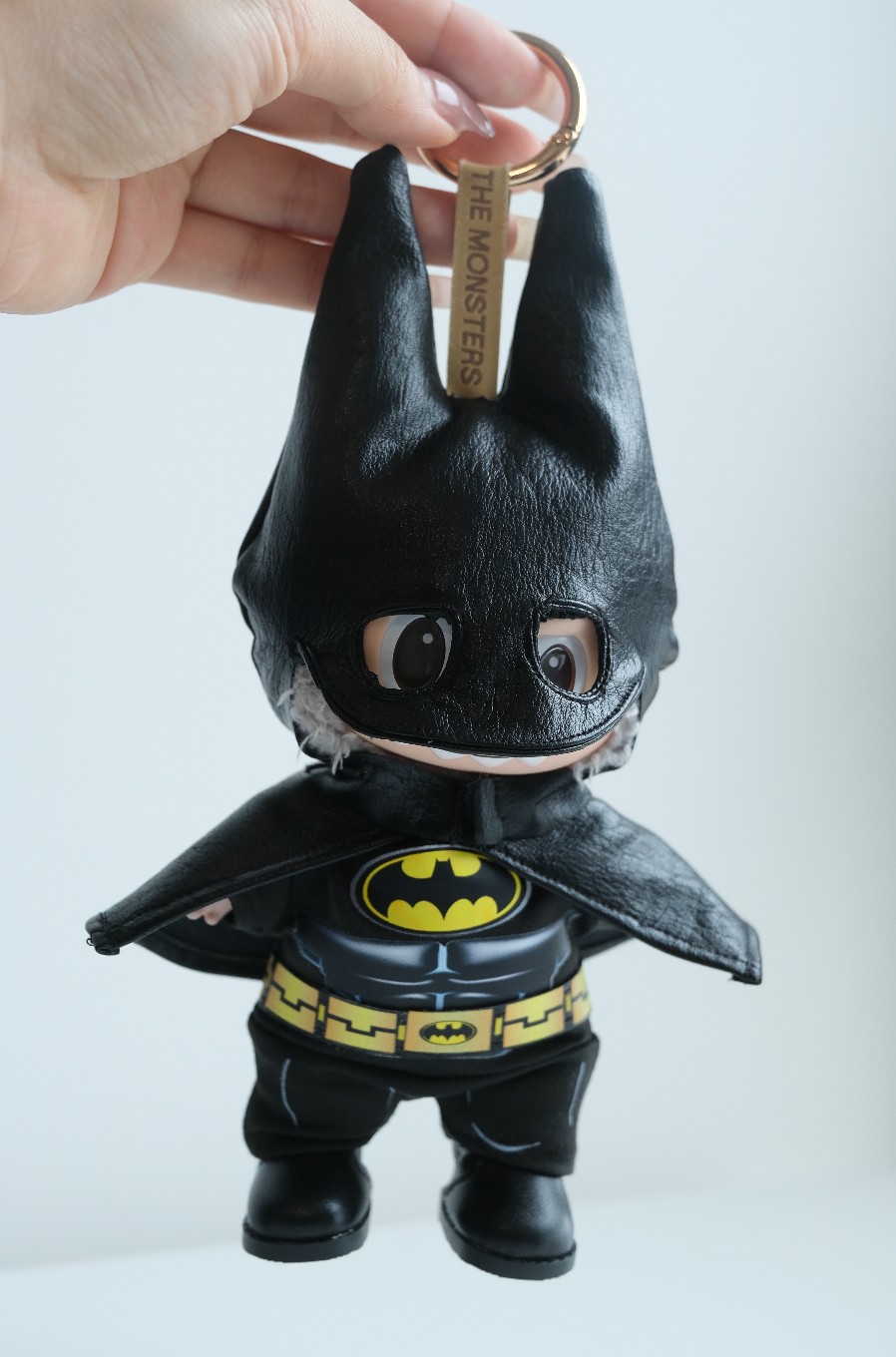 labubu Plush keychain shaped like a batman with a visible brand tag o