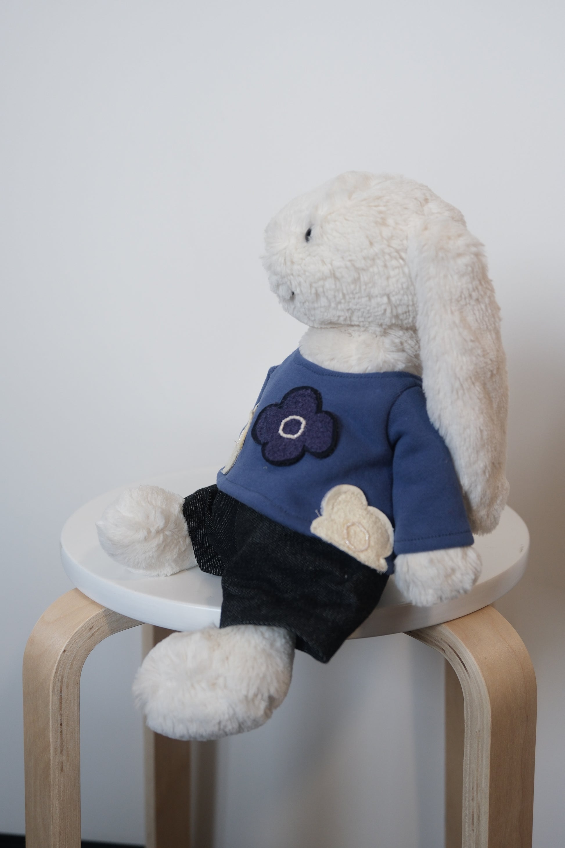Jellycat Bashful Bunny wearing a 2-piece minimalist casual outfit with a simple T-shirt and matching pants.