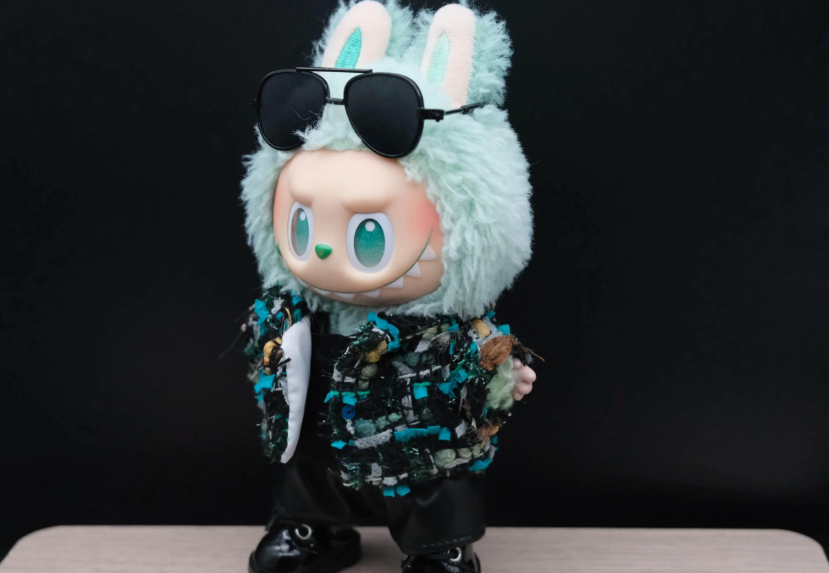 LABUBU plush doll wearing a handmade black tweed jacket with blue and green threads