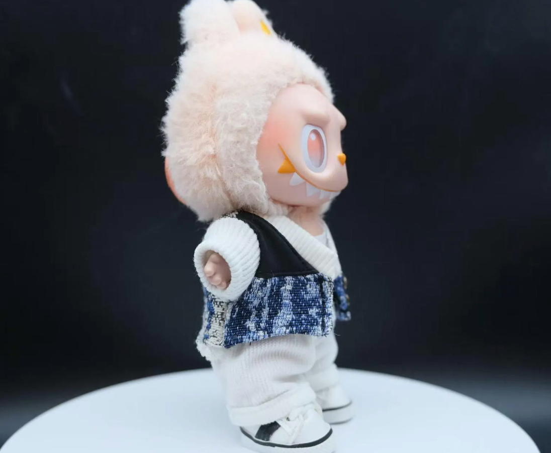 LABUBU plush doll wearing a textured black jacket and black and white plaid pants