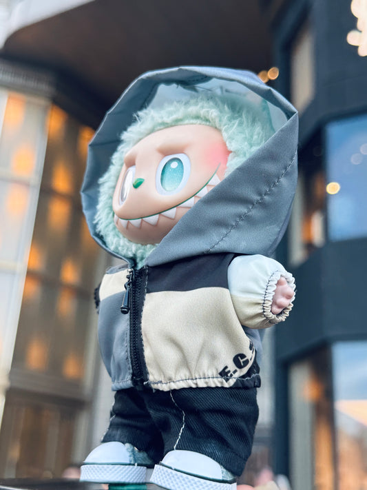 A side view of a Labubu figure wearing a functional windbreaker