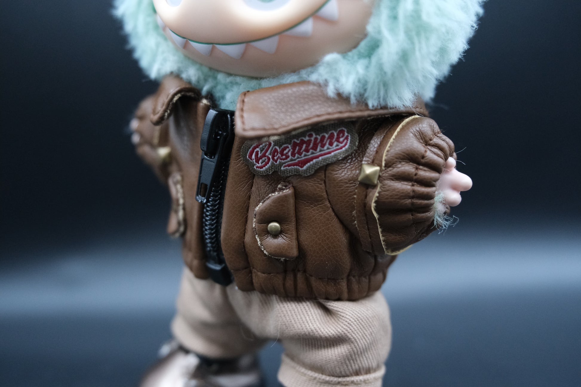 details of laubu wear a  brown leather jacket, pants and shoes